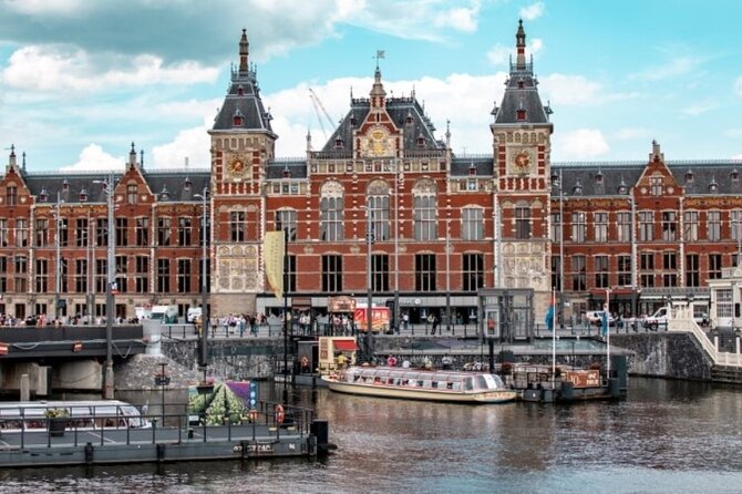 5 hrs Golden Age Amsterdam Private Walking Tour With Local Guide - Canals, narrow houses, and the old city gate