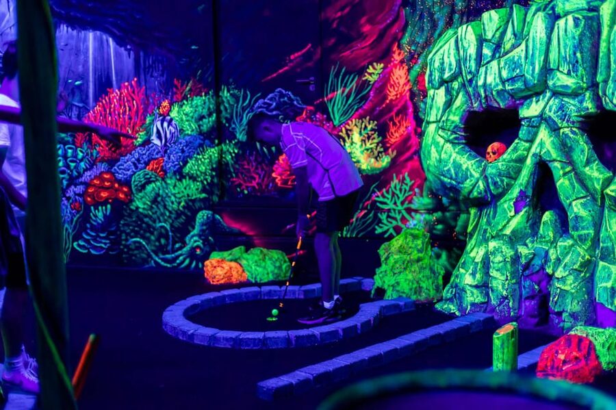 Aloha Amsterdam: 12-Hole Glow-in-the-Dark Mini-Golf - Twelve holes through a glowing maritime world