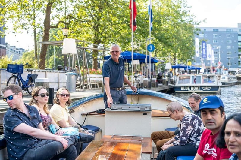 Amsterdam: 75 minute Open Boat Canal Cruise with Live Guide - Starting opposite the Hard Rock Cafe