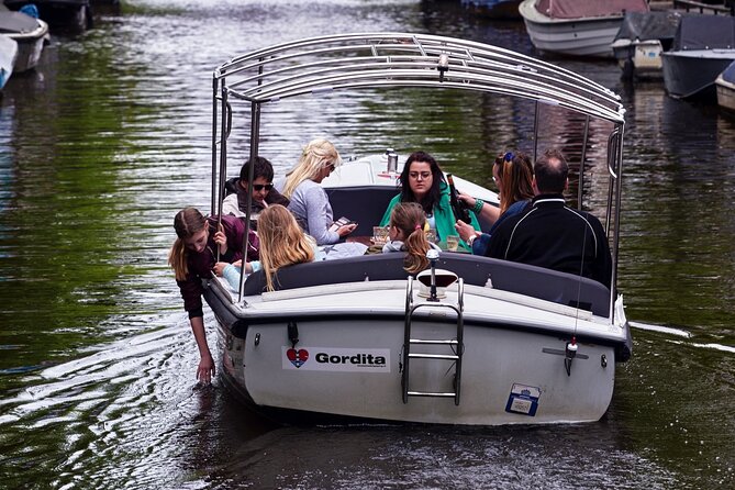 Amsterdam 90-min Private Canal Cruise with Live Guide and Drinks - Drinks, blankets, and weather