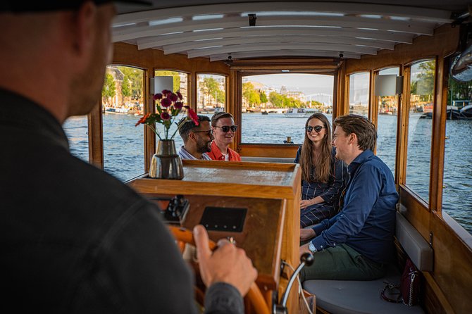 Amsterdam Breakfast Cruise on Private Luxury Boat - Breakfast with Amsterdam moving past the windows