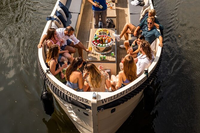 Amsterdam: Canal Booze Cruise with Unlimited Drinks Option - The Amstel and Amsterdam Light Festival sights