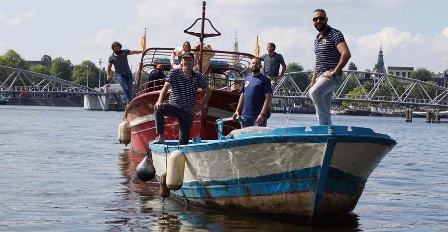 Amsterdam: Canal Cruise on a Wooden Refugee Boat - A refugee boat with a second life in Amsterdam