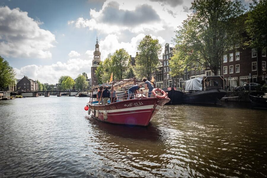 Amsterdam: Canal Cruise on a Wooden Refugee Boat - Personal stories from guides who rebuilt their lives