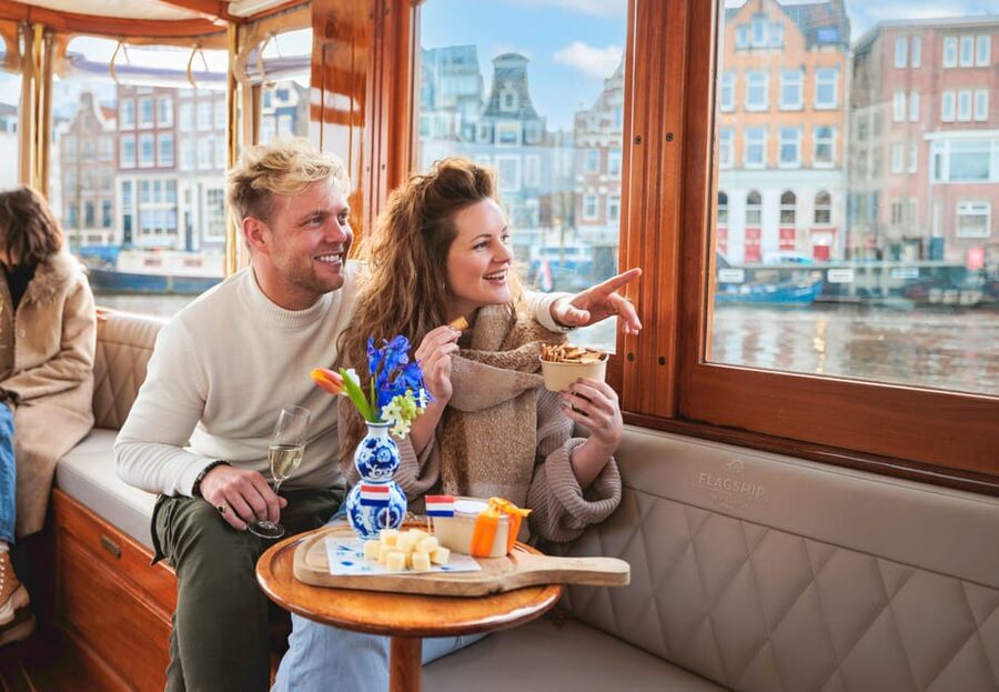 Amsterdam: Canal Cruise with Bubbles & Bites - Boarding the covered boat