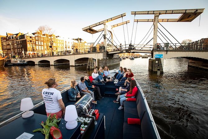 Amsterdam Canal Cruise With Live Guide and Unlimited Drinks - Unlimited drinks and the social mood