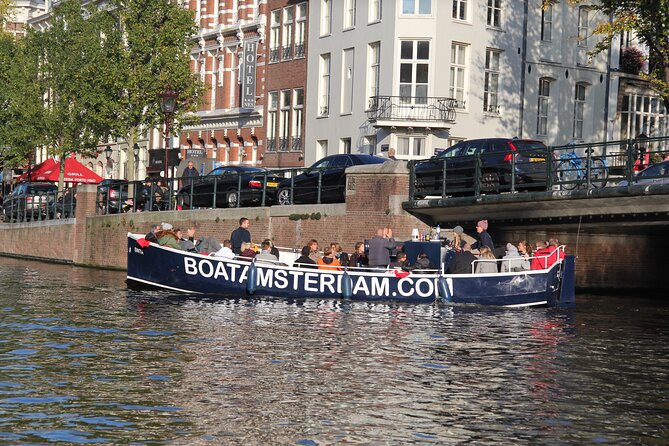 Amsterdam Canal Cruise with Open Bar - Central Station - Canal museums, merchant houses, and the Munt Tower