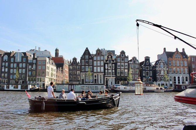 Amsterdam Canal Tour by Open Boat – 90 min Small Group Experience - De Wallen, the Old Church, and the Kolk Sluice
