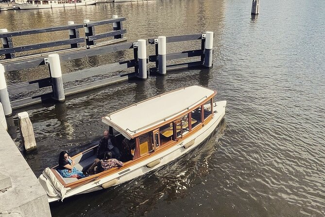 Amsterdam Champagne Private Canal Cruise - Passing the Magere Brug and other canal sights