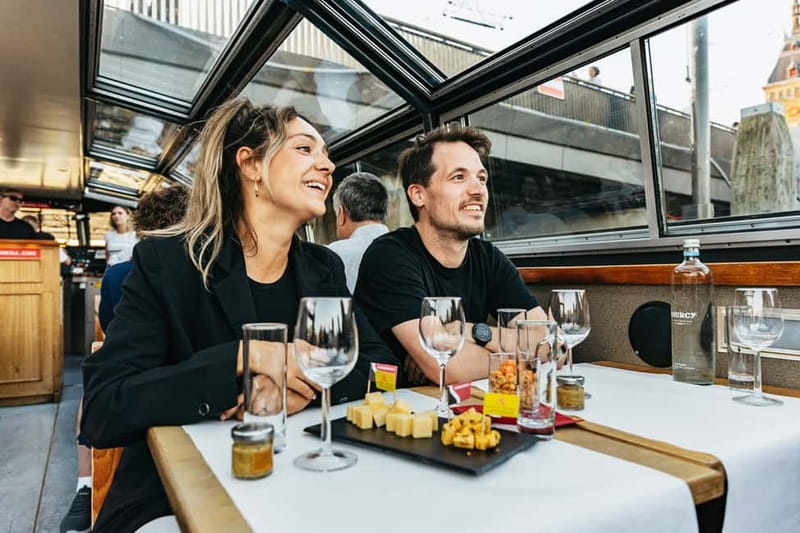 Amsterdam: Cheese & Wine Cruise Tasting Experience - Dutch cheese, salty snacks, and an open glass