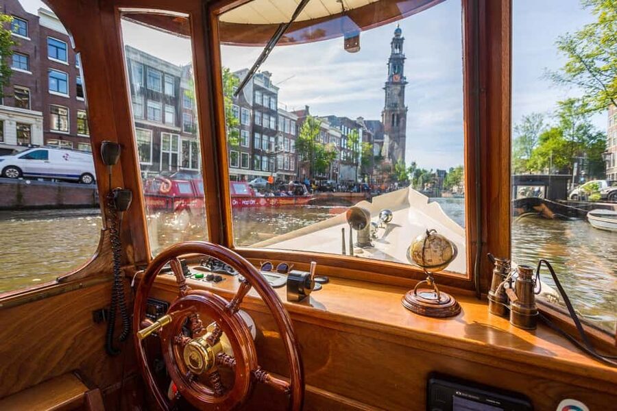 Amsterdam: Classic Boat Cruise with Optional Cheese & Wine - What the guide adds to a one-hour ride