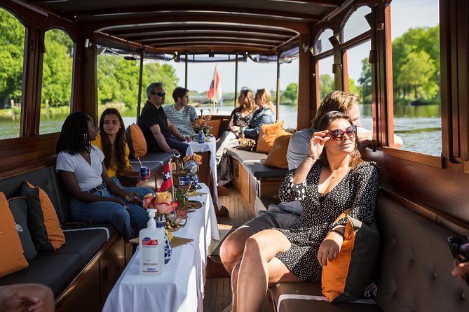 Amsterdam Classic Saloon Boat Cruise with Drinks and Cheese - The Amstel and Amsterdam’s story