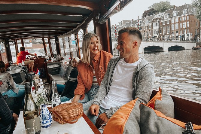 Amsterdam Classic Saloon Boat Cruise with Drinks and Cheese - Rijksmuseum, Bloemenmarkt, and the central canals