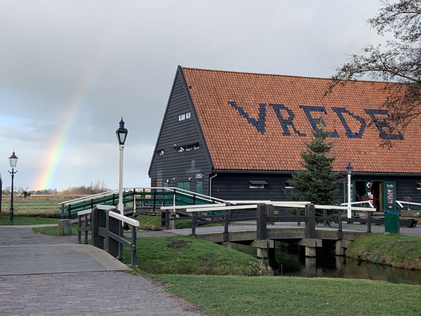 Amsterdam: Countryside Bike Tour and Zaanse Schans Windmills - Industrial windmills with a working purpose