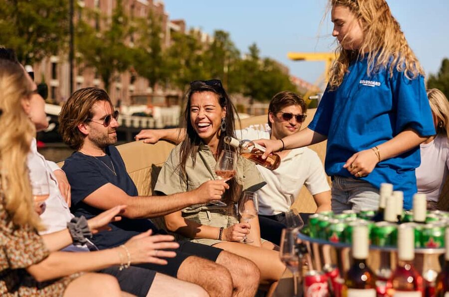 Amsterdam: Cozy Evening Canal Cruise With Open Bar Option - A small boat, not a big sightseeing barge
