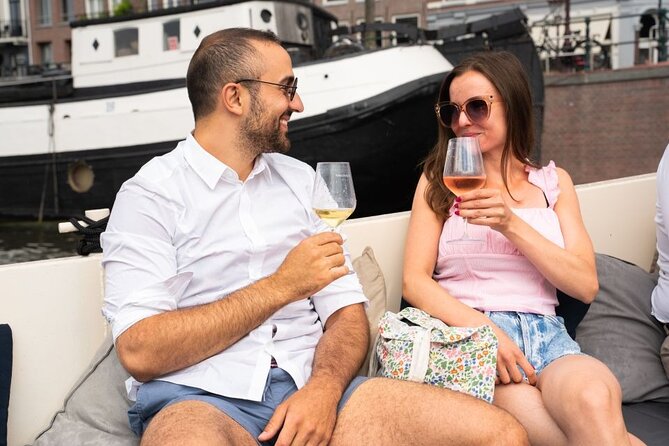 Amsterdam: Evening Candle Light Cruise With Wine & Cheese - Damrak’s famous Dancing Houses