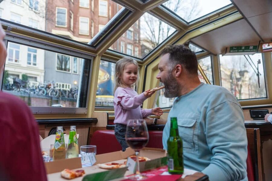 Amsterdam: Evening Pizza Cruise Along the Canals - Following the route from Damrak to the Canal Belt