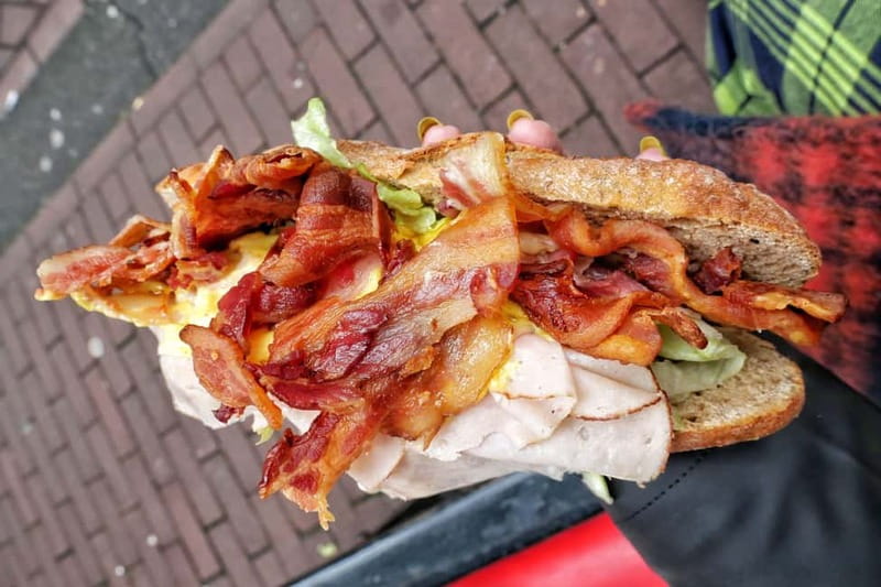 Amsterdam: Guided Food Tour with Tastings - Walking or cycling through Amsterdam