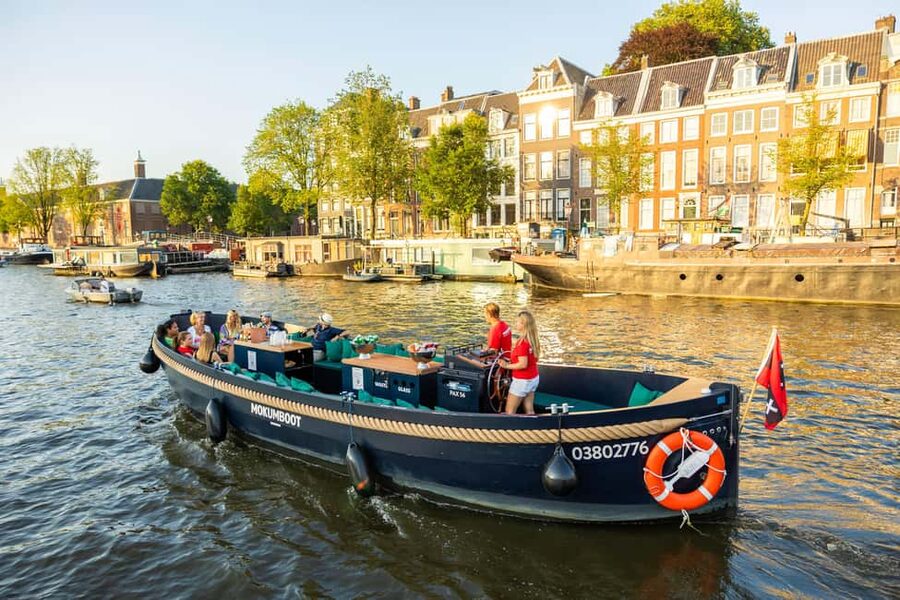 Amsterdam: Guided Open Boat Canal Cruise Including Drink - Should you book the Mokumboot cruise?