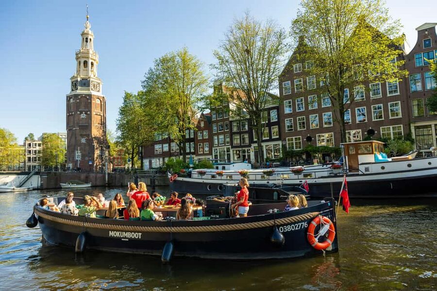 Amsterdam: Guided Open Boat Canal Cruise Including Drink - The western canal belt and its famous sights