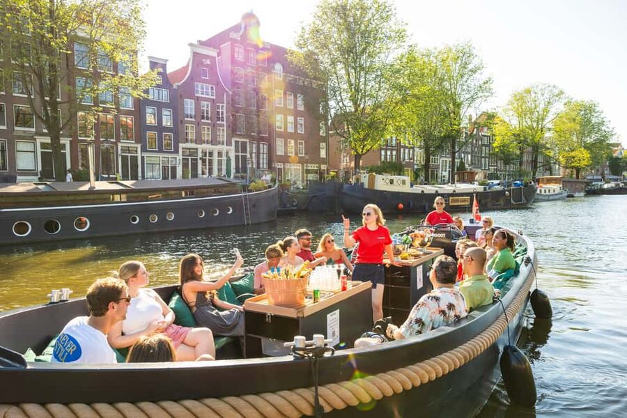 Amsterdam: Guided Open Boat Canal Cruise Including Drink - Meeting Mokumboot beside Amsterdam Centraal