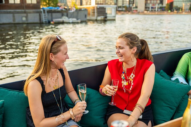 Amsterdam: Guided Open Boat Canal Cruise Unlimited Drinks Option - The Amstel, theater district, and Magere Brug