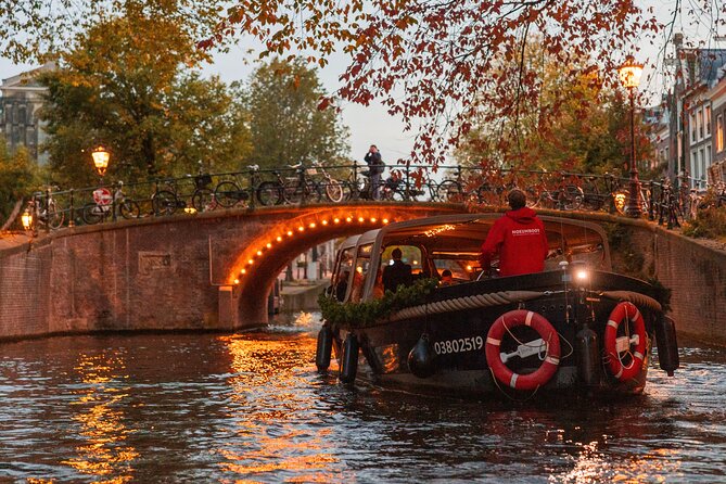 Amsterdam: Light Festival Open Boat - Unl. Drinks Option - Montelbaanstoren, a watchtower with an odd nickname