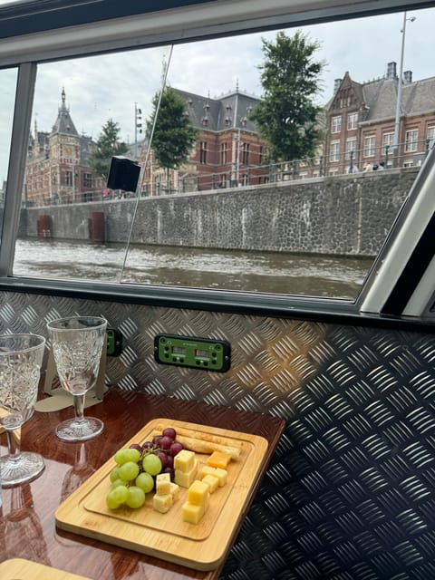 Amsterdam: Luxury Cheese & Wine Canal Cruise - An open boat changes the packing list