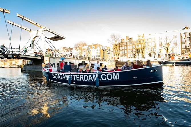 Amsterdam Open Boat Cruise with Live Guide and Two Drinks - Open air in summer, cover when the weather turns