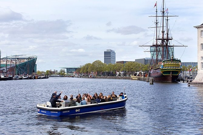 Amsterdam Open Boat Sightseeing Canal Cruise - The Amstel Hotel and the river setting