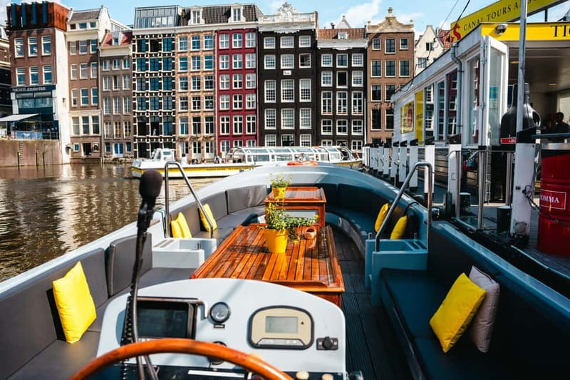 Amsterdam: Open Boat Tour of Canals with Expert Local Guide - Open seating, blankets, and weather planning