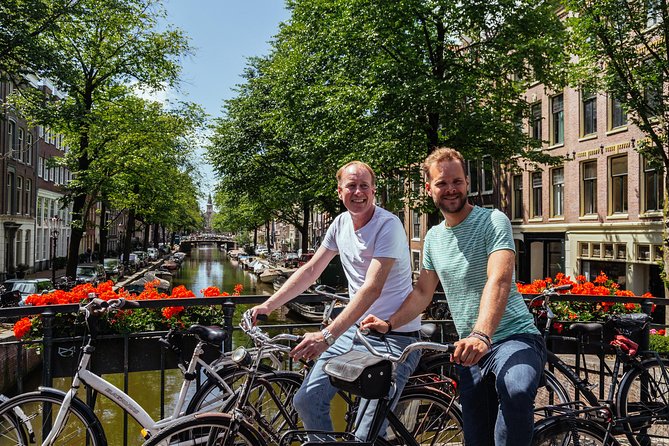 Amsterdam PRIVATE Bike Tour With Locals: Bike & Local Snack Included - Jordaan lanes, markets, and quieter streets