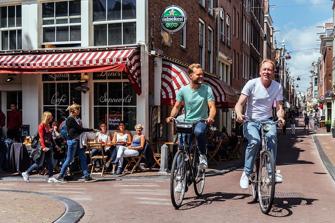 Amsterdam PRIVATE Bike Tour With Locals: Bike & Local Snack Included - Westerkerk and the western canal belt