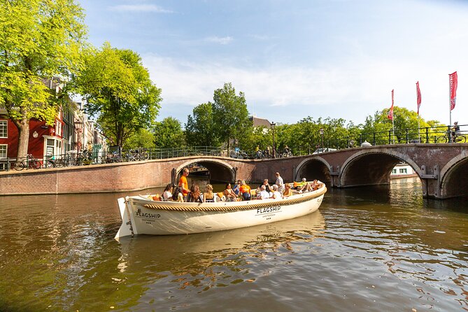 Amsterdam Private Boat Trip with Pizza and Unlimited Drinks - Museums, markets, and modern Amsterdam