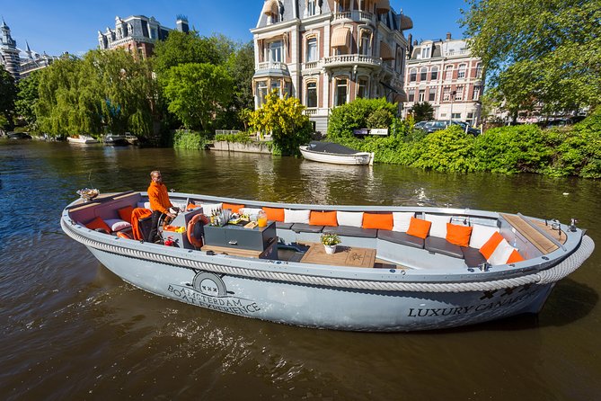 Amsterdam Private Boat Trip With Skipper, Burger and Beers - Bridges, flowers, and science along the water