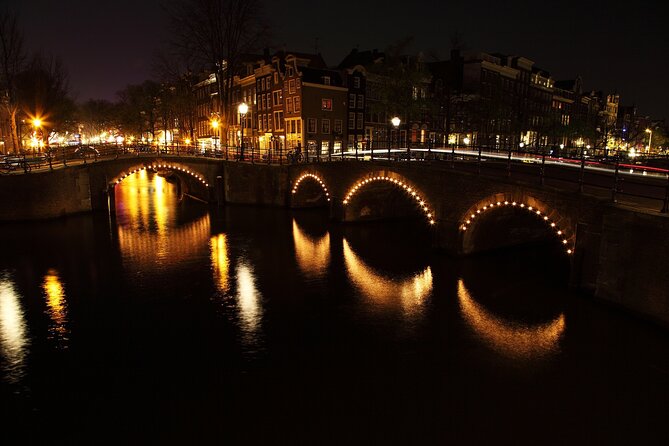 Amsterdam: Private Romantic Evening Canal Cruise + Bubbles/Snacks - Skinny Bridge and the canal lights