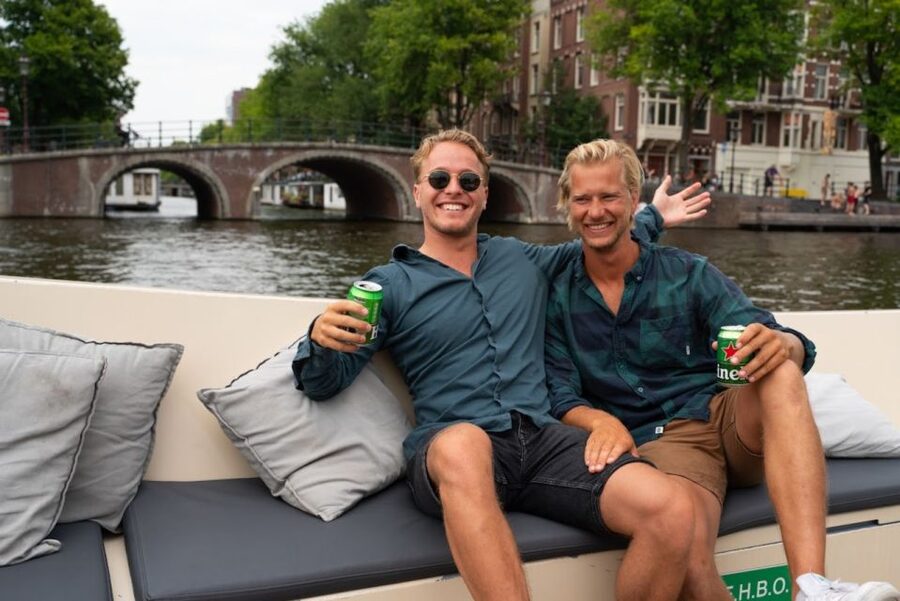 Amsterdam: Red-Light District Pub Crawl and Booze Boat Tour - A canal cruise before the night begins