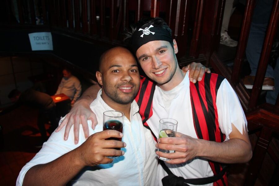 Amsterdam: Red-Light District Pub Crawl and Booze Boat Tour - Four pubs, games, and a simple social formula