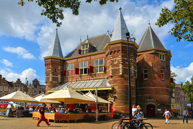 Amsterdam Red Light District Treasure: Self-Guided Tour & Quest - Montelbaanstoren and Amsterdam’s Defensive Past