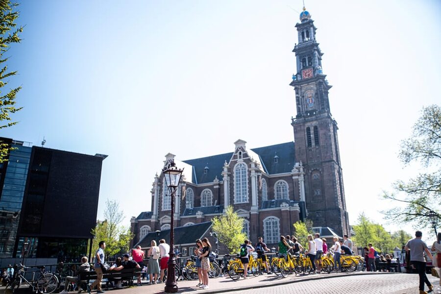 Amsterdam: Relaxed City Highlights Guided Bike Tour - Leidseplein, music, squatting, and city life