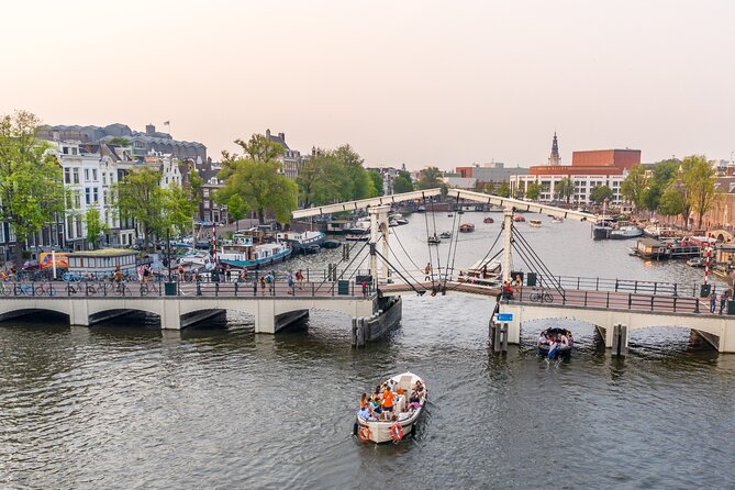 Amsterdam: Saloon Boat Cruise + Unlimited Drinks & Bite option - Boat comfort, weather, and boarding details