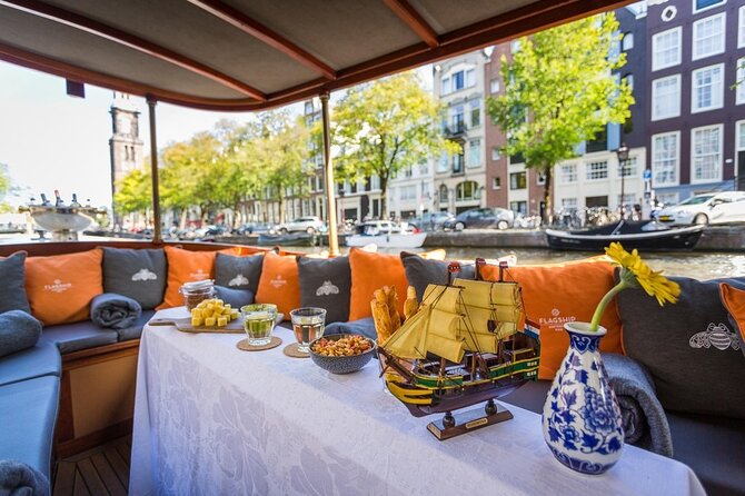 Amsterdam Small-Group Bike Tour With Canal Cruise, Drinks, Cheese - An hour on Amsterdam’s canals
