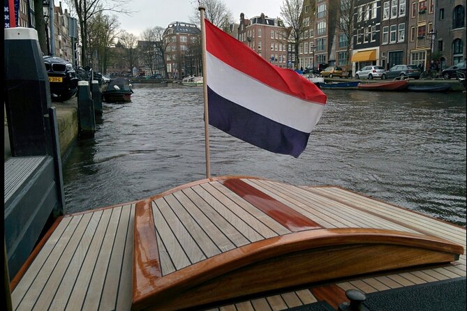 Amsterdam small-group canal cruise in 1920s saloon boat - Herengracht and Keizersgracht