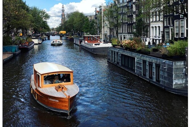 Amsterdam small-group canal cruise in 1920s saloon boat - Reguliersgracht and the city’s smaller waterways
