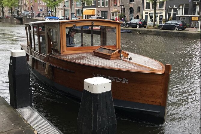 Amsterdam small-group canal cruise in 1920s saloon boat - Crossing toward Magere Brug
