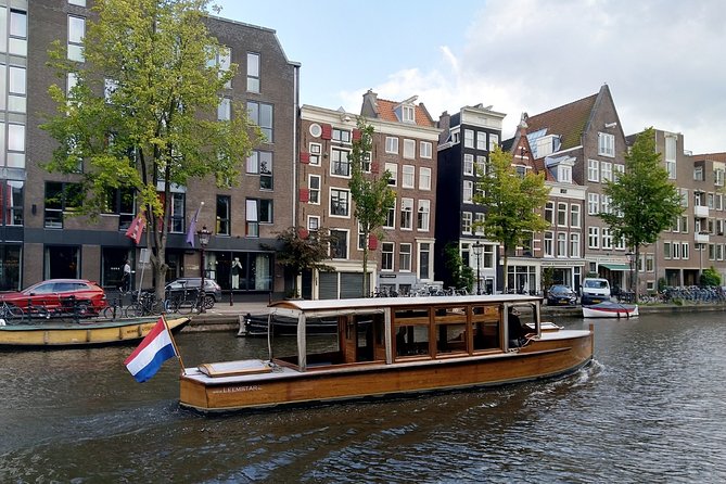 Amsterdam small-group canal cruise in 1920s saloon boat - Meeting at Prinsengracht 579