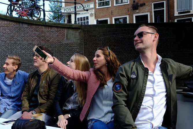 Amsterdam Small-Group Canal Cruise Including Snacks and Drinks - Why a small electric sloop changes the canal ride