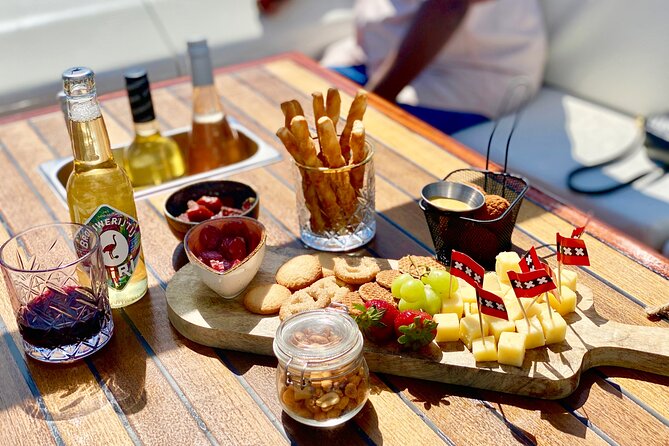 Amsterdam Small-Group Canal Cruise Including Snacks and Drinks - From Jordaan to the Amstel and Red Light District