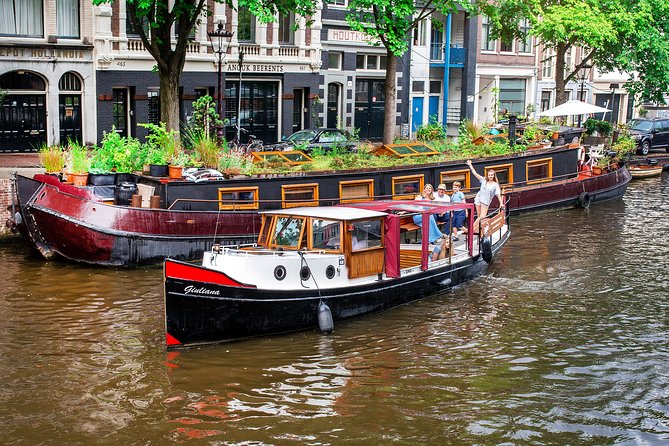 Amsterdam Small-Group Canal Cruise With Dutch Snacks and Drink - The old center, flea market, and red-light district