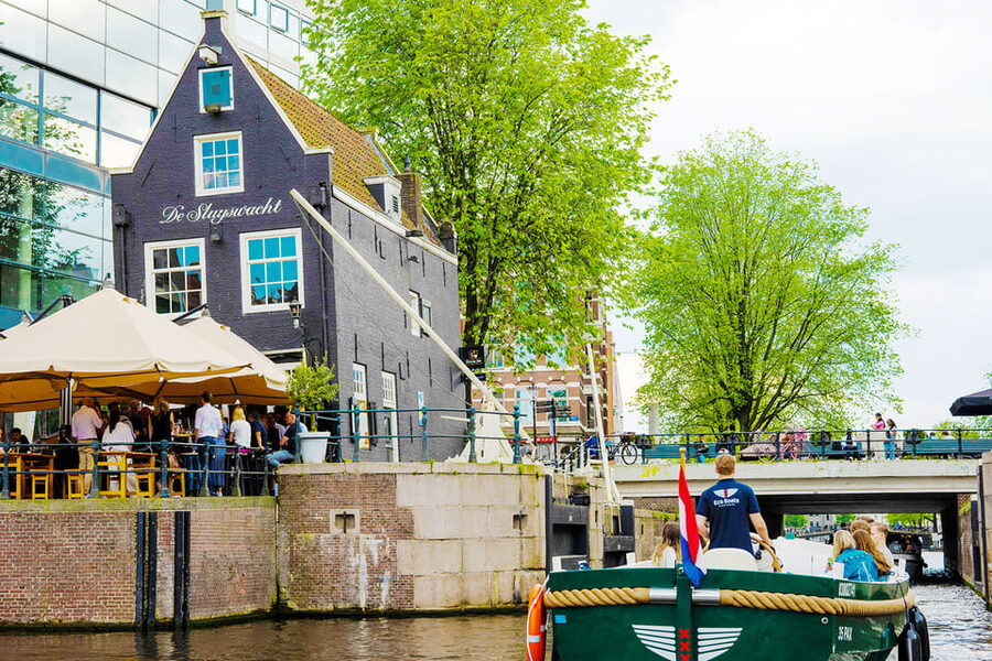 Amsterdam: The Newest Canal Cruise with Drink Option - Open boat, rain cover, and drinks
